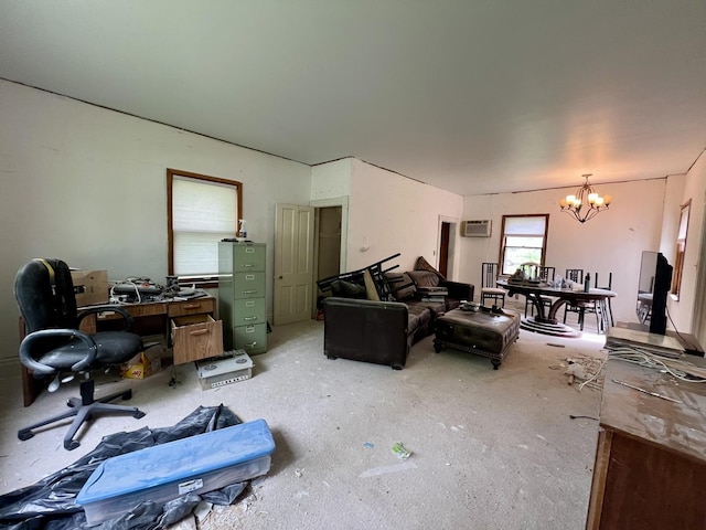 866 E Center St, Paxton, IL 60957 - carpeted living area featuring a chandelier, a wall unit AC, and an office area