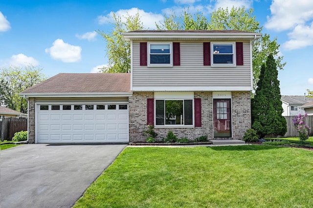 3025 Diane Dr, Aurora, IL 60504 - colonial inspired home featuring driveway, a garage, and brick siding