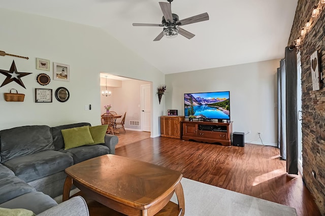 3025 Diane Dr, Aurora, IL 60504 - living room featuring wood finished floors, a chandelier, ceiling fan, high vaulted ceiling, and baseboards