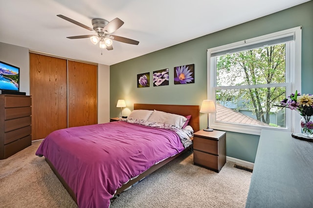 3025 Diane Dr, Aurora, IL 60504 - bedroom featuring carpet flooring, a closet, a ceiling fan, and baseboards