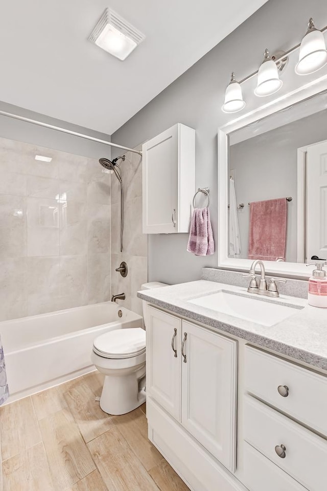 3025 Diane Dr, Aurora, IL 60504 - bathroom featuring toilet, shower / bathtub combination with curtain, vanity, and wood finished floors