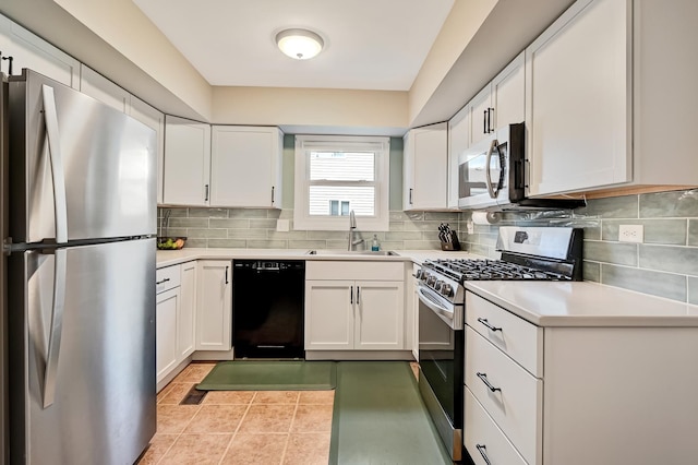 3025 Diane Dr, Aurora, IL 60504 - kitchen with stainless steel appliances, a sink, decorative backsplash, and light countertops