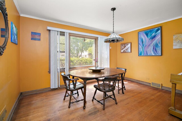 11125 S Fairfield Ave, Chicago, IL 60655 - dining space featuring wood finished floors, crown molding, and baseboards