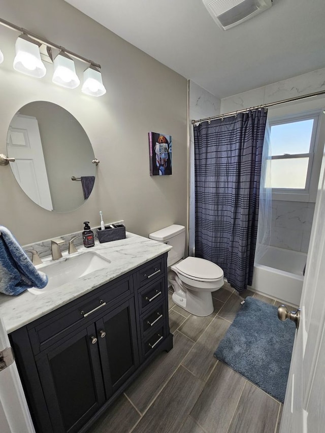 8 W Emerson St, Arlington Heights, IL 60005 - bathroom featuring toilet, vanity, wood finished floors, and shower / bath combination with curtain