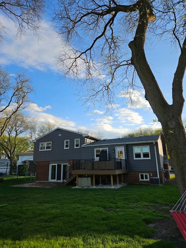 8 W Emerson St, Arlington Heights, IL 60005 - rear view of property featuring a deck, stairway, a lawn, brick siding, and central AC unit