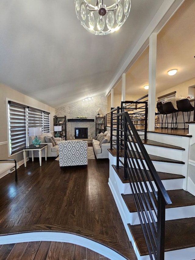 8 W Emerson St, Arlington Heights, IL 60005 - living area featuring stairs, vaulted ceiling, a chandelier, and wood finished floors