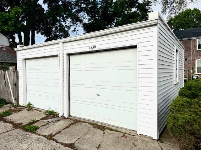 garage featuring fence