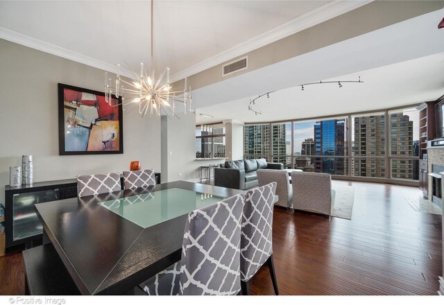 21 E Huron St Unit 3204, Chicago, IL 60611 - dining room featuring a chandelier, wood finished floors, and crown molding