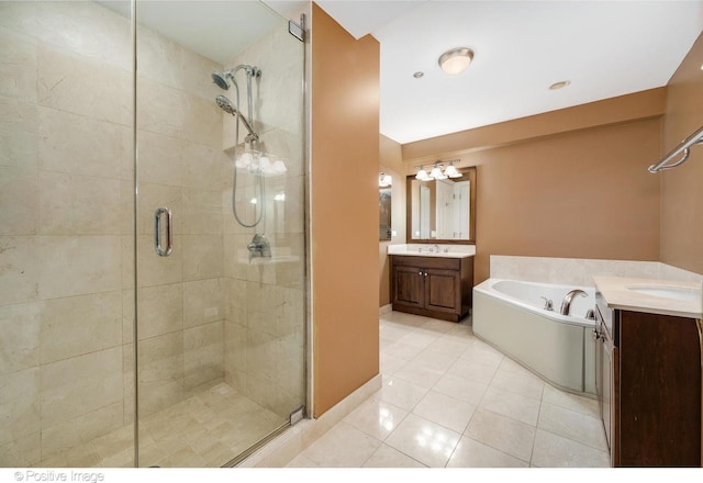 21 E Huron St Unit 3204, Chicago, IL 60611 - full bathroom with a shower stall, a garden tub, tile patterned floors, and two vanities