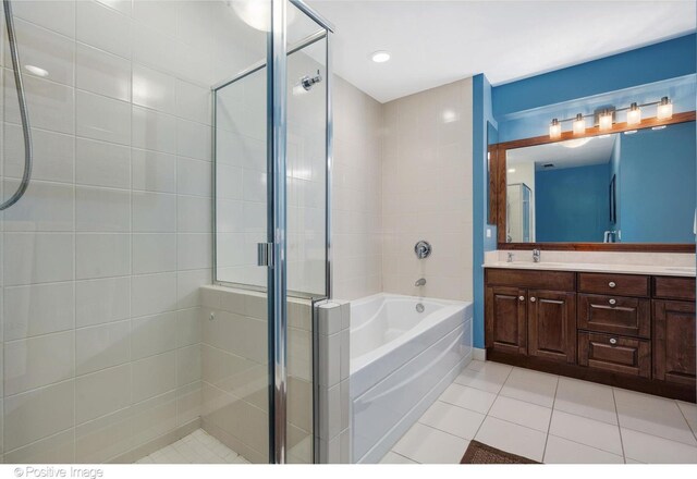 21 E Huron St Unit 3204, Chicago, IL 60611 - bathroom with tile patterned flooring, a shower stall, a garden tub, and vanity