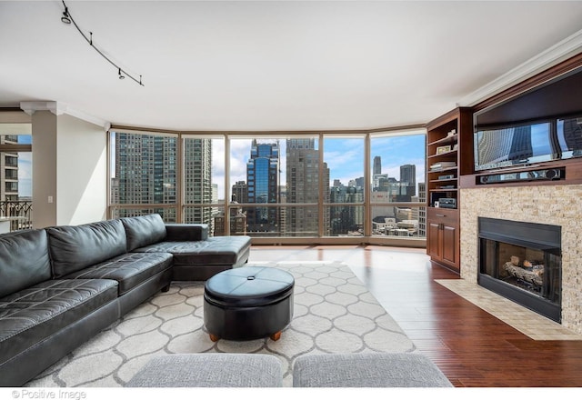 21 E Huron St Unit 3204, Chicago, IL 60611 - living room featuring wood finished floors, a fireplace with flush hearth, floor to ceiling windows, and crown molding