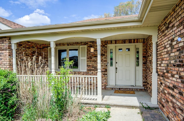 14801 Jean Ct, Oak Forest, IL 60452 - view of exterior entry featuring brick siding, covered porch, and roof with shingles