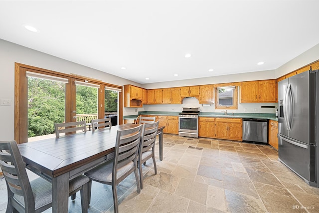 14801 Jean Ct, Oak Forest, IL 60452 - kitchen with stainless steel appliances, stone tile flooring, recessed lighting, brown cabinets, and a sink