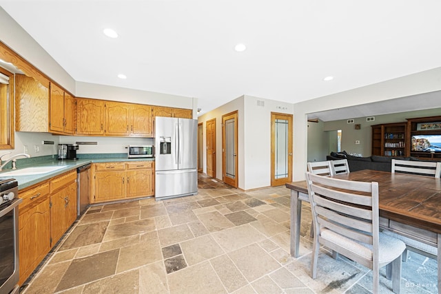 14801 Jean Ct, Oak Forest, IL 60452 - kitchen featuring appliances with stainless steel finishes, a sink, stone tile floors, light countertops, and recessed lighting