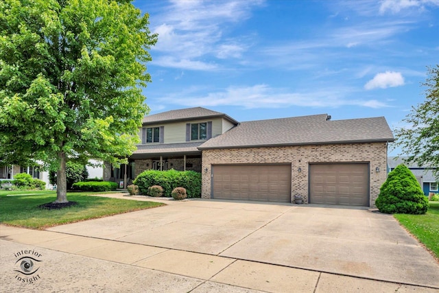 975 S Laura Ln, Coal City, IL 60416 - traditional home featuring an attached garage, a front yard, concrete driveway, and brick siding