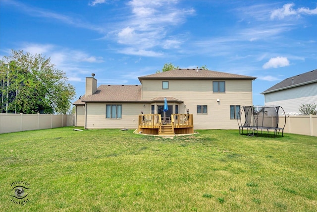 975 S Laura Ln, Coal City, IL 60416 - rear view of house with a trampoline, a wooden deck, and a chimney