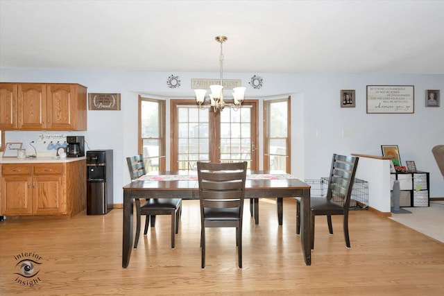975 S Laura Ln, Coal City, IL 60416 - dining space featuring light wood finished floors, a chandelier, and healthy amount of natural light