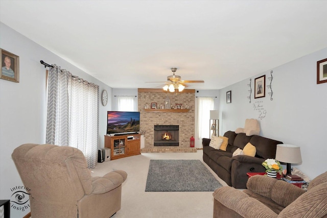 975 S Laura Ln, Coal City, IL 60416 - living room with light colored carpet, ceiling fan, and a fireplace