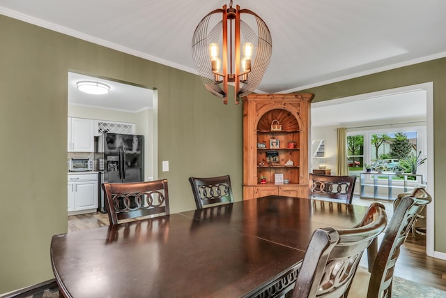 1723 Victor Ter, Gurnee, IL 60031 - dining area featuring a chandelier, light wood-style floors, and crown molding