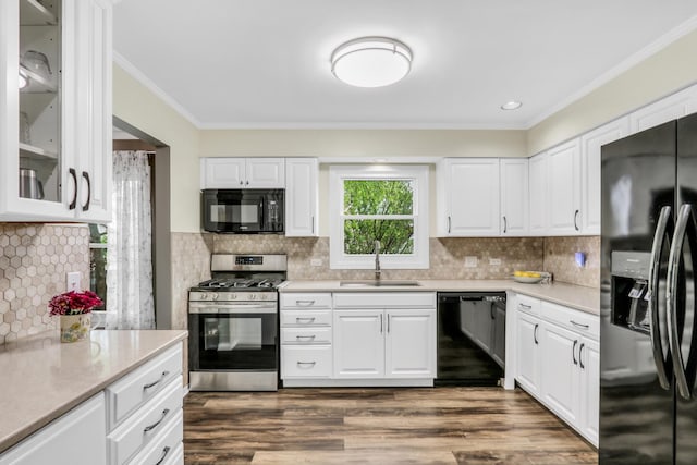 1723 Victor Ter, Gurnee, IL 60031 - kitchen with black appliances, a sink, ornamental molding, light countertops, and dark wood-type flooring