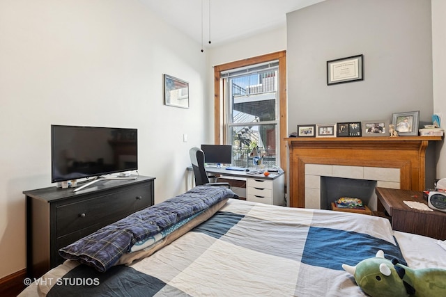 bedroom featuring an office area