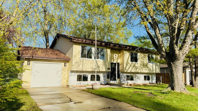 527 Northgate Rd, Lindenhurst, IL 60046 - bi-level home featuring concrete driveway, an attached garage, and a front yard
