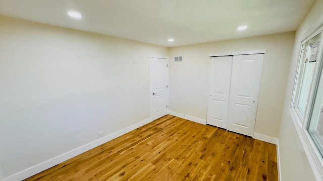 527 Northgate Rd, Lindenhurst, IL 60046 - unfurnished bedroom featuring wood finished floors, recessed lighting, baseboards, and a closet