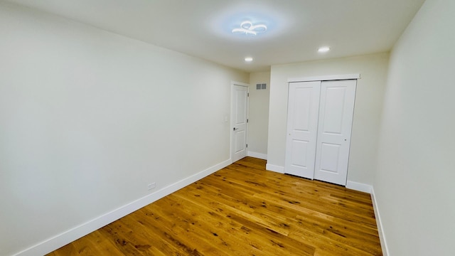 527 Northgate Rd, Lindenhurst, IL 60046 - unfurnished bedroom featuring wood finished floors, recessed lighting, baseboards, and a closet