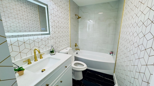 527 Northgate Rd, Lindenhurst, IL 60046 - bathroom with tile walls, toilet, washtub / shower combination, vanity, and marble finish floors