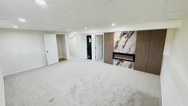 527 Northgate Rd, Lindenhurst, IL 60046 - finished below grade area with carpet floors, a glass covered fireplace, recessed lighting, and baseboards