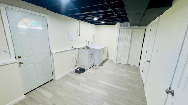 527 Northgate Rd, Lindenhurst, IL 60046 - laundry area featuring washer and clothes dryer, light wood-style floors, and baseboards