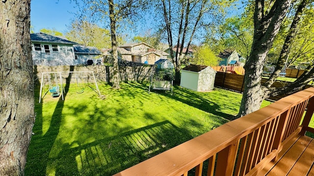 527 Northgate Rd, Lindenhurst, IL 60046 - view of yard featuring a storage shed, an outbuilding, a playground, a residential view, and a wooden deck