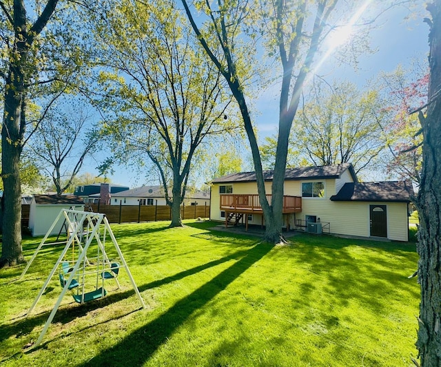 527 Northgate Rd, Lindenhurst, IL 60046 - view of yard with a deck, an outdoor structure, a playground, and a storage shed