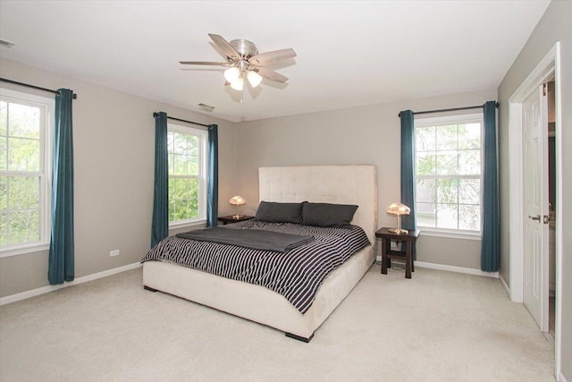 1207 Angle Tarn, West Dundee, IL 60118 - bedroom with light carpet, baseboards, multiple windows, and ceiling fan