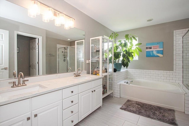 1207 Angle Tarn, West Dundee, IL 60118 - full bathroom featuring a shower stall, a bath, double vanity, and tile patterned flooring