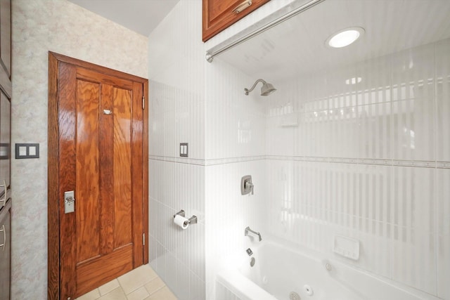 full bath with tile walls, a combined bath / shower with jetted tub, and tile patterned floors