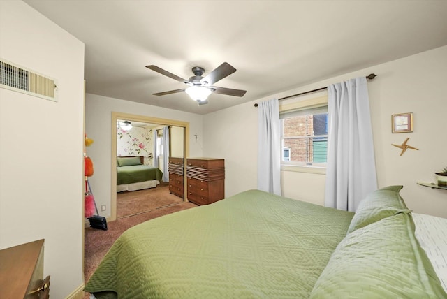 carpeted bedroom featuring a closet and a ceiling fan