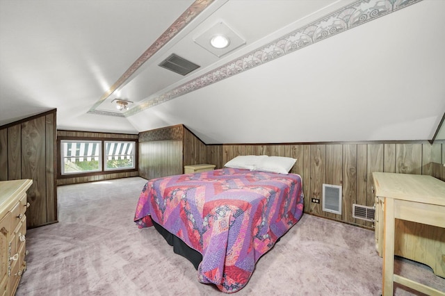carpeted bedroom featuring wooden walls and lofted ceiling