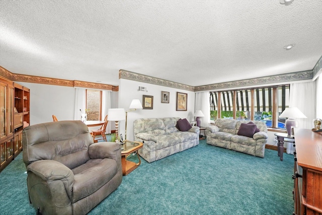 carpeted living room featuring plenty of natural light and a textured ceiling