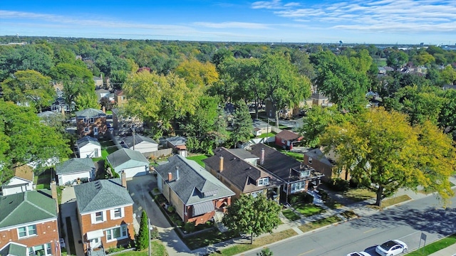aerial perspective of suburban area featuring a heavily wooded area