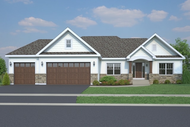 410 Mallard Point Dr, North Aurora, IL 60542 - view of front of house with stone siding, a front lawn, a garage, and asphalt driveway