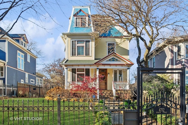 4752 N Beacon St, Chicago, IL 60613 - victorian house with a porch and a gate