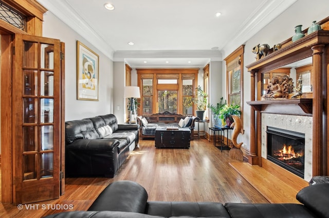 4752 N Beacon St, Chicago, IL 60613 - living area featuring a tiled fireplace, ornamental molding, wood finished floors, and recessed lighting