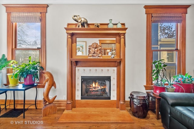 4752 N Beacon St, Chicago, IL 60613 - living area featuring wood finished floors and a tile fireplace