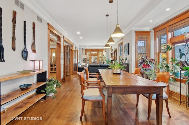 4752 N Beacon St, Chicago, IL 60613 - dining area featuring ornamental molding, healthy amount of natural light, french doors, light wood-type flooring, and recessed lighting
