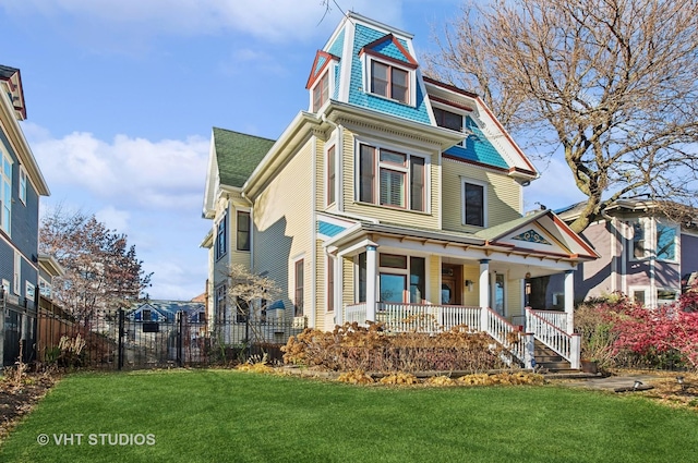 4752 N Beacon St, Chicago, IL 60613 - victorian-style house featuring a porch and a shingled roof