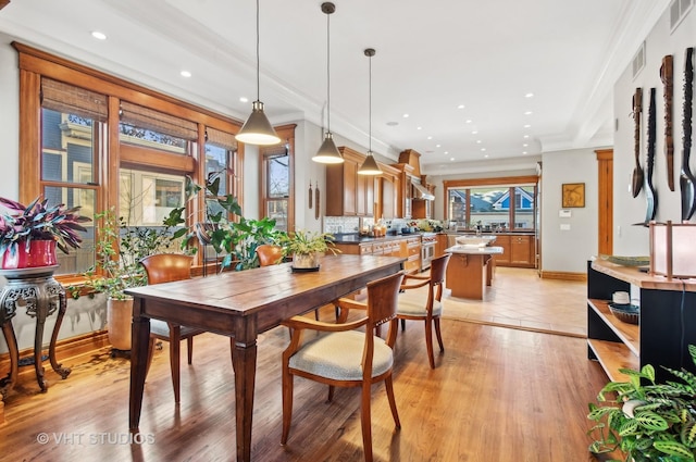 4752 N Beacon St, Chicago, IL 60613 - dining room with plenty of natural light, recessed lighting, light wood finished floors, and ornamental molding