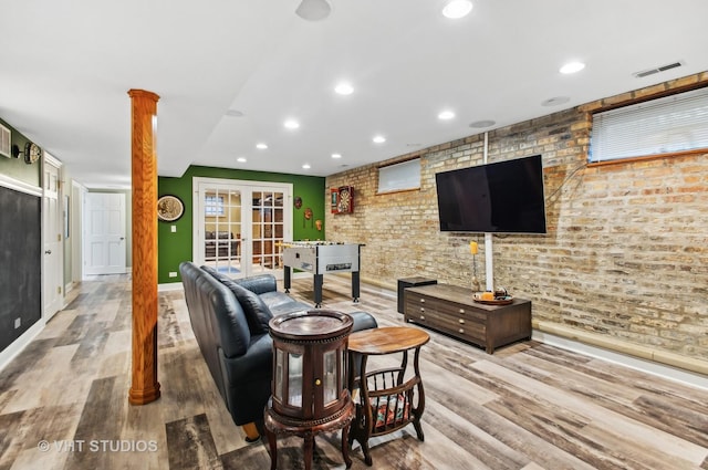 4752 N Beacon St, Chicago, IL 60613 - living area featuring wood finished floors, baseboards, recessed lighting, french doors, and ornate columns