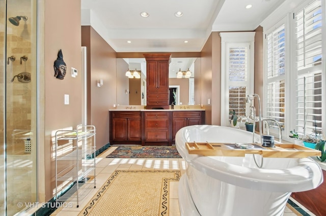 4752 N Beacon St, Chicago, IL 60613 - full bathroom with a stall shower, ornate columns, recessed lighting, baseboards, and tile patterned floors