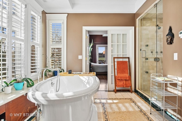 4752 N Beacon St, Chicago, IL 60613 - full bath with a shower stall, tile patterned floors, and a freestanding tub